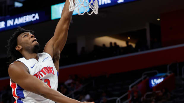 Detroit Pistons center James Wiseman (13) shoots on Portland Trail Blazers forward Jerami Grant (9) in the second half at Little Caesars Arena. Mandatory Credit Rick Osentoski-USA TODAY Sports